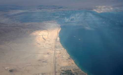 An aerial view of the coast of the Red Sea is pictured through the window of an airplane near Sharm el-Sheikh, Egypt December 16, 2017. Picture taken December 16, 2017. REUTERS/Amr Abdallah Dalsh - RC1E55356010