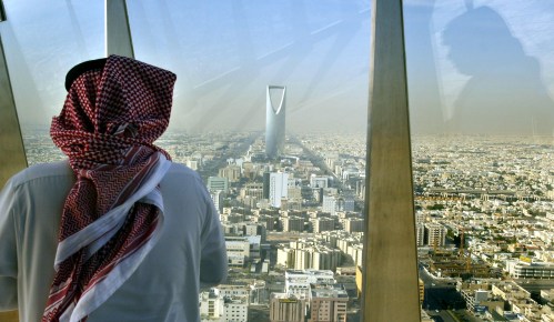 A man looks at central Riyadh from the Faisaliah Tower - Saudi Arabia, December 14, 2003. - PBEAHUOLTBX