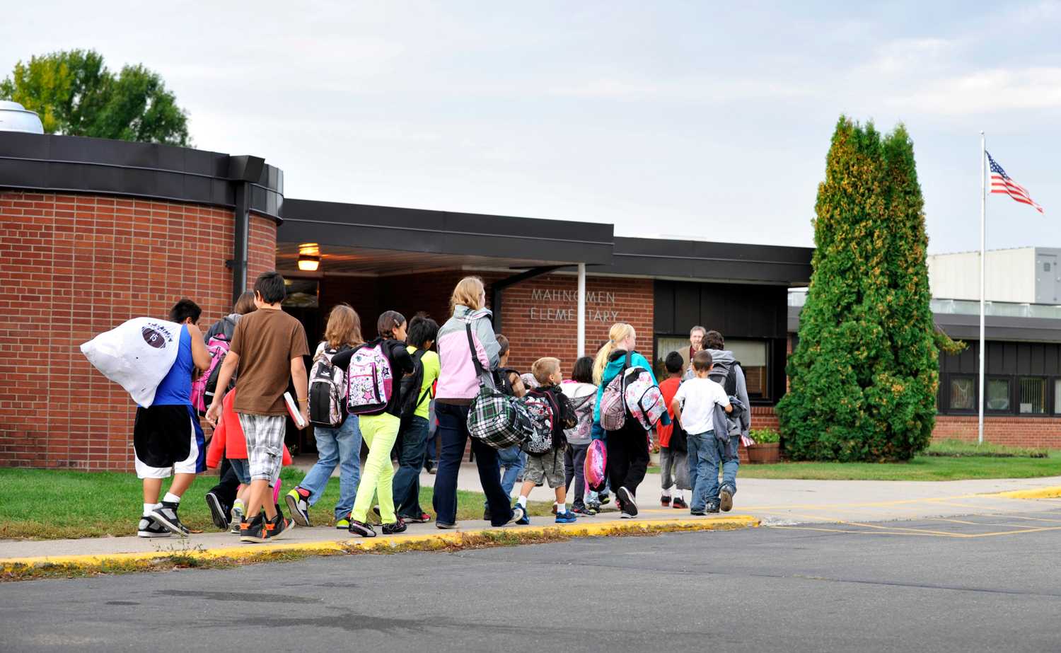 Students arrive for class at Mahnomen Elementary School in Mahnomen, Minnesota
