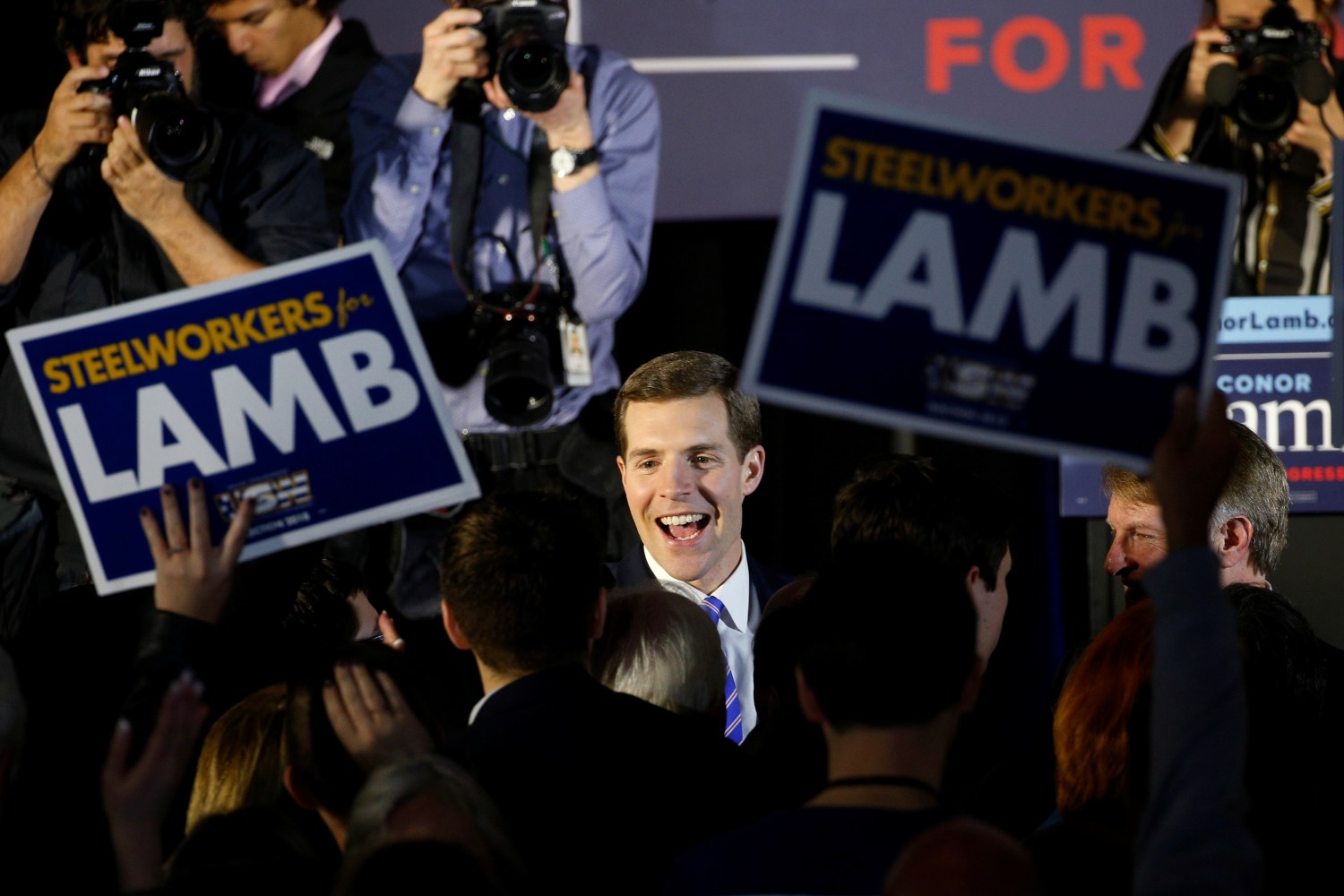 U.S. Democratic congressional candidate Conor Lamb is greeted by supporters during his election night rally in Pennsylvania's 18th U.S. Congressional district special election against Republican candidate and State Rep. Rick Saccone, in Canonsburg, Pennsylvania, March 13, 2018. REUTERS/Brendan McDermid - RC190011A7B0