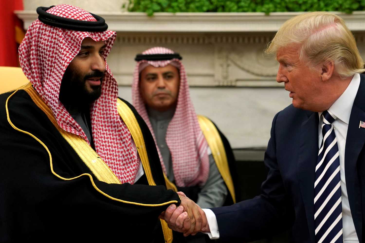 U.S. President Donald Trump shakes hands with Saudi Arabia's Crown Prince Mohammed bin Salman in the Oval Office at the White House in Washington