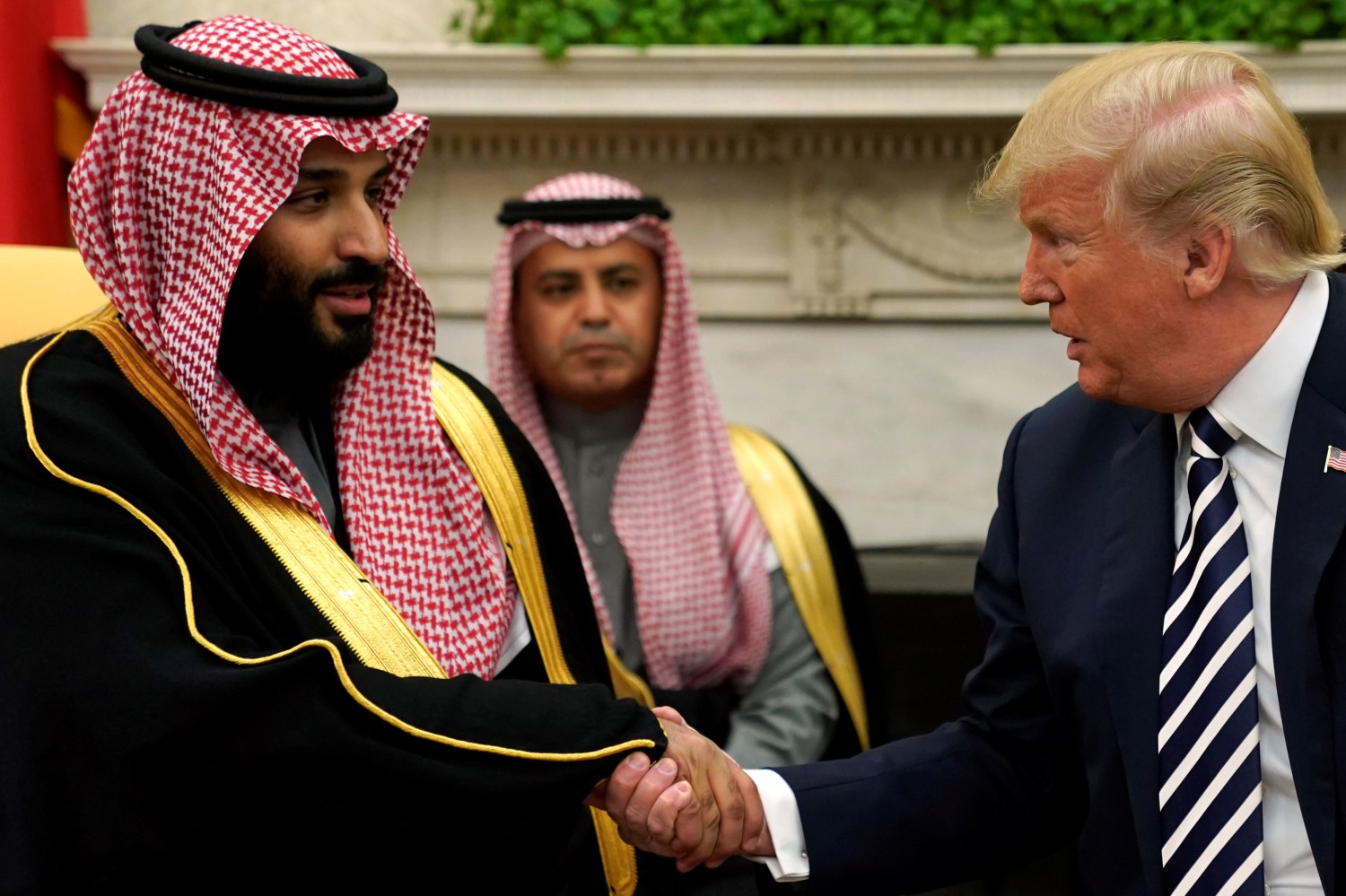 U.S. President Donald Trump shakes hands with Saudi Arabia's Crown Prince Mohammed bin Salman in the Oval Office at the White House in Washington