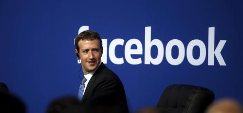 Facebook CEO Mark Zuckerberg on stage during a town hall.