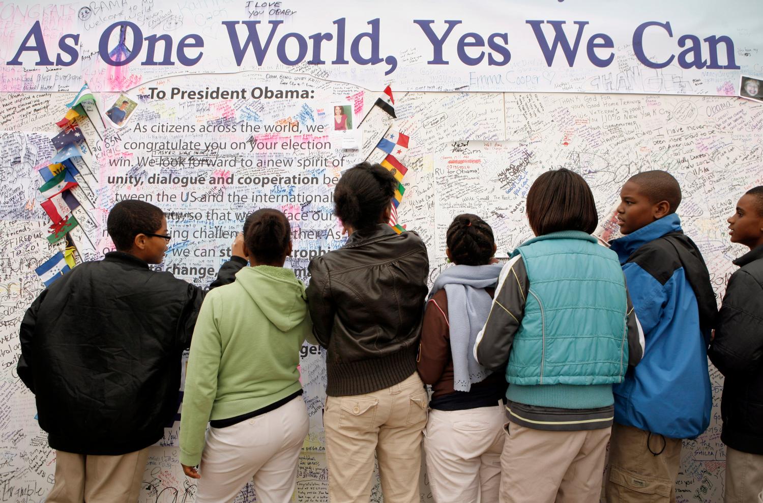 Students sign a message board dedicated to Barack Obama in Washington, D.C.