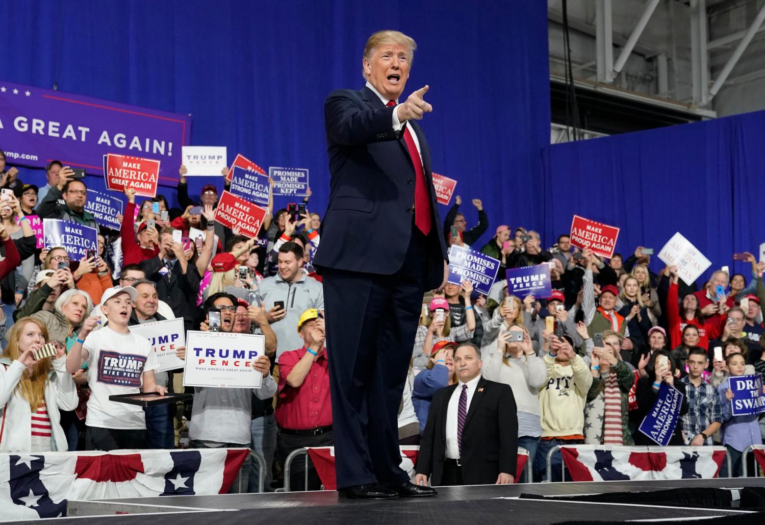U.S. President Donald Trump points at supporters after speaking in support of Republican congressional candidate Rick Saccone during a Make America Great Again rally in Moon Township, Pennsylvania, U.S., March 10, 2018. REUTERS/Joshua Roberts - HP1EE3B05DFC5