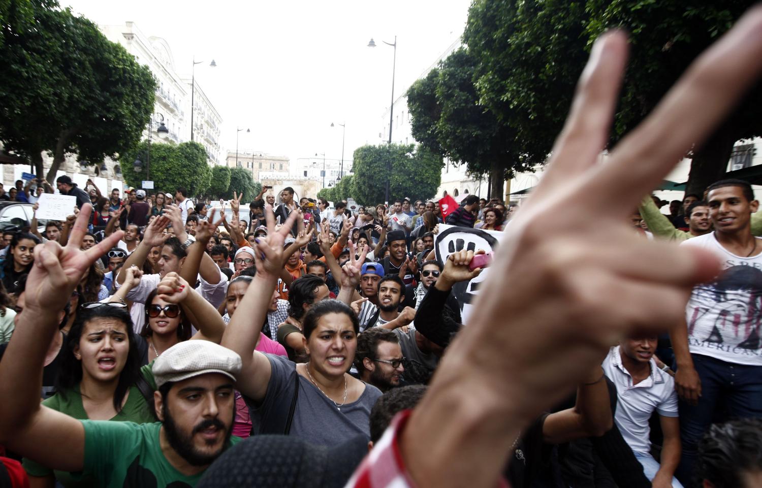 Protesters shout slogans during a protest against the government on the first anniversary of the first free Tunisian election, in Tunis October 23, 2012. Tension has been growing between Islamists and secularists since the Islamist Ennahda Movement won an election after the toppling of secular autocrat Zine al-Abidine Ben Ali last year in the first of the "Arab Spring" uprisings. REUTERS/Anis Mili