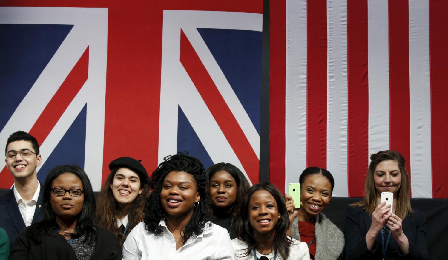 Students listen as U.S. President Barack Obama speaks during a town hall at the Royal Agricultural Halls in London, Britain