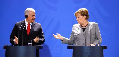German Chancellor Angela Merkel speaks to Turkish Prime Minister Binali Yildirim during the news conference at the Chancellery in Berlin, Germany February 15, 2018. REUTERS/Fabrizio Bensch TPX