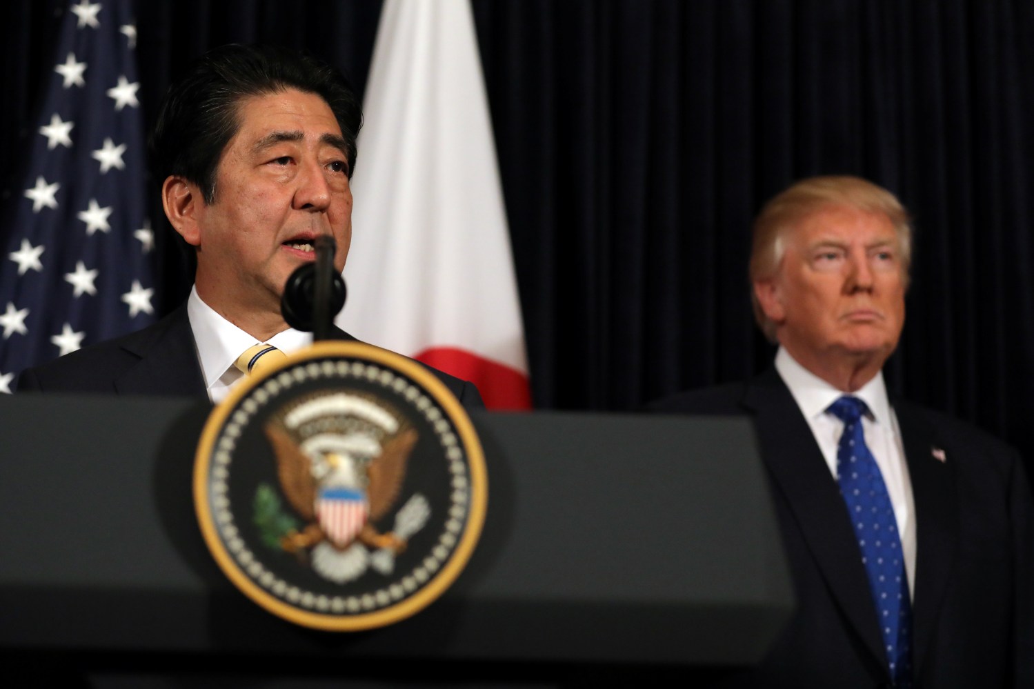 Japanese Prime Minister Shinzo Abe delivers remarks on North Korea accompanied by U.S. President Donald Trump at Mar-a-Lago club in Palm Beach, Florida U.S., February 11, 2017. REUTERS/Carlos Barria - RC1FD8CE5350
