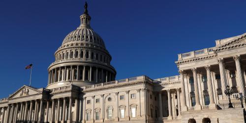 People walk by the U.S. Capitol building in Washington, U.S., February 8, 2018. REUTERS/ Leah Millis - RC13B8F2EB90