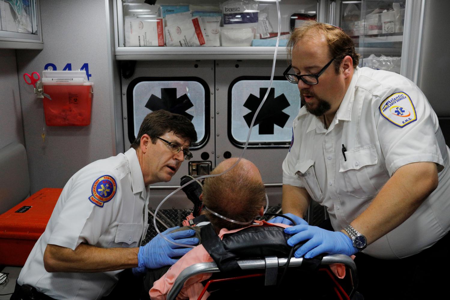 DATE IMPORTED:December 22, 2017Cataldo Ambulance medics John Gardner (L) and David Farmer care for a man in his 40's who was found unresponsive after overdosing on an opioid in the Boston suburb of Salem, Massachusetts, August 9, 2017. The victim received a total of 12mg of naloxone. Nurses at the hospital recognised the man, saying he was brought in the day before after overdosing. REUTERS/Brian Snyder