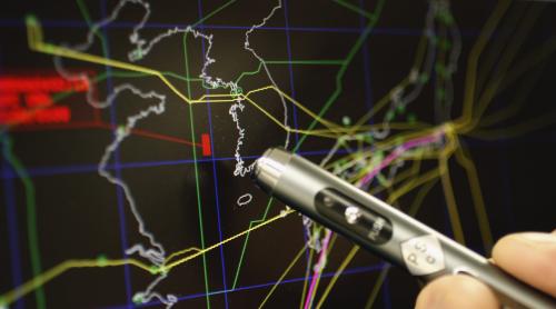 Norio Tomine, Japan Airlines' (JAL) flight operations route planning director, points at a map of the Korean Peninsula showing a no-fly zone that would avoid an accident with North Korea's planned long-range rocket launch at JAL's pilot ready room at Haneda Airport in Tokyo April 11, 2012. Japanese airlines have made changes to flight routes in the east of the Philippines, where the North Korean missile's second-stage booster is expected to fall if the rocket is launched, following instructions from Philippine air authorities to close usual routes during North Korea's expected launch period, according to Tomine. The launch of the Unha-3 rocket, which North Korea says will merely put a weather satellite into space, has been condemned by its neighbours and the West as a long-range ballistic missile test. REUTERS/Yuriko Nakao (JAPAN - Tags: TRANSPORT POLITICS) - GM1E84B1DXY01