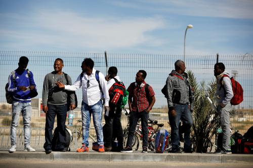 African migrants stand outside the Holot detention centre, due to shut down on March 15, in Negev desert, Israel March 13, 2018. REUTERS/Amir Cohen - RC14514076D0