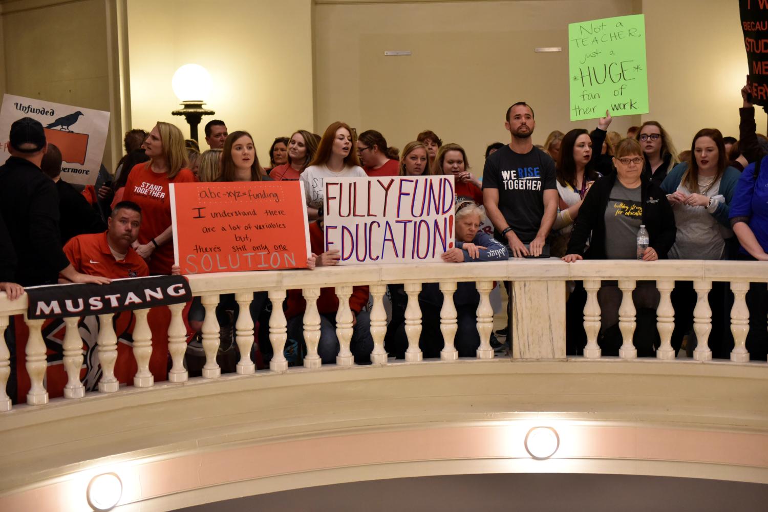 Teachers pack the state Capitol rotunda to capacity on the second day of a teacher walkout to demand higher pay and more funding for education in Oklahoma City