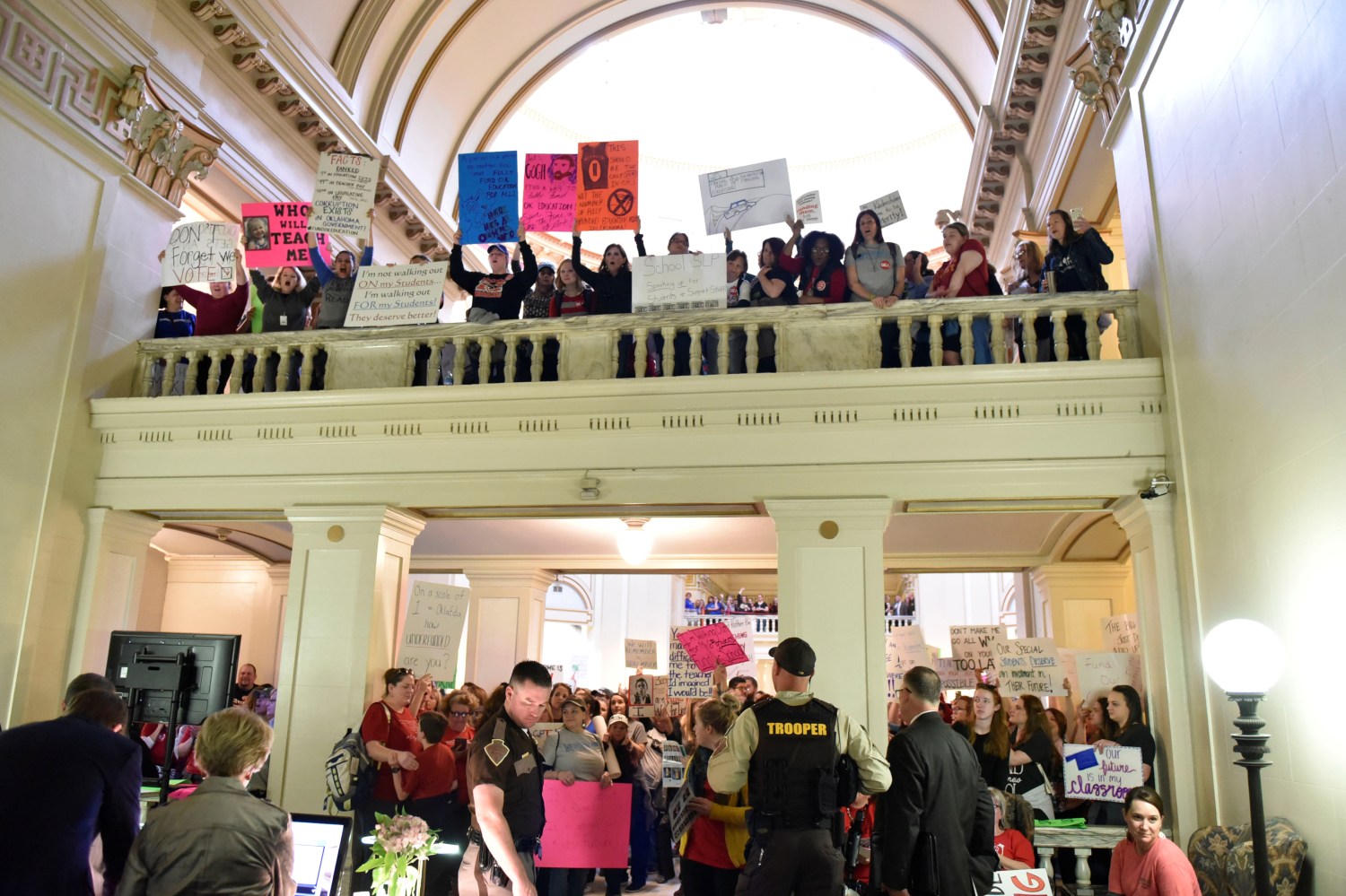 Teachers chant outside of the House of Representatives at the Capitol on the second day of a teacher walkout to demand higher pay and more funding for education in Oklahoma City