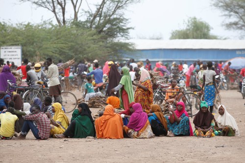 Women wait in line to receive aid at the Kakuma refugee camp in northern Kenya, March 6, 2018. Picture taken March 6, 2018. REUTERS/Baz Ratner - RC13532EA3B0