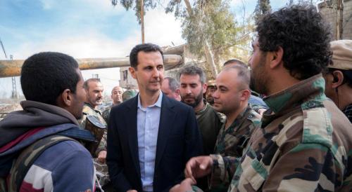Syrian President Bashar al-Assad meets with Syrian army soldiers.