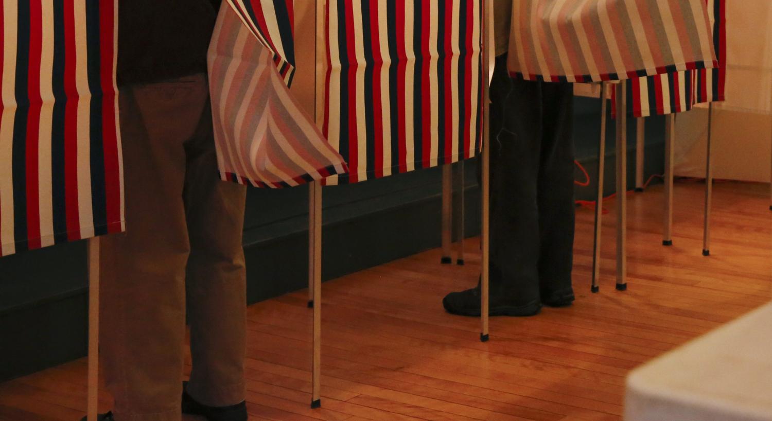People vote at a polling place at the Canterbury Town Hall polling station in Canterbury, New Hampshire.