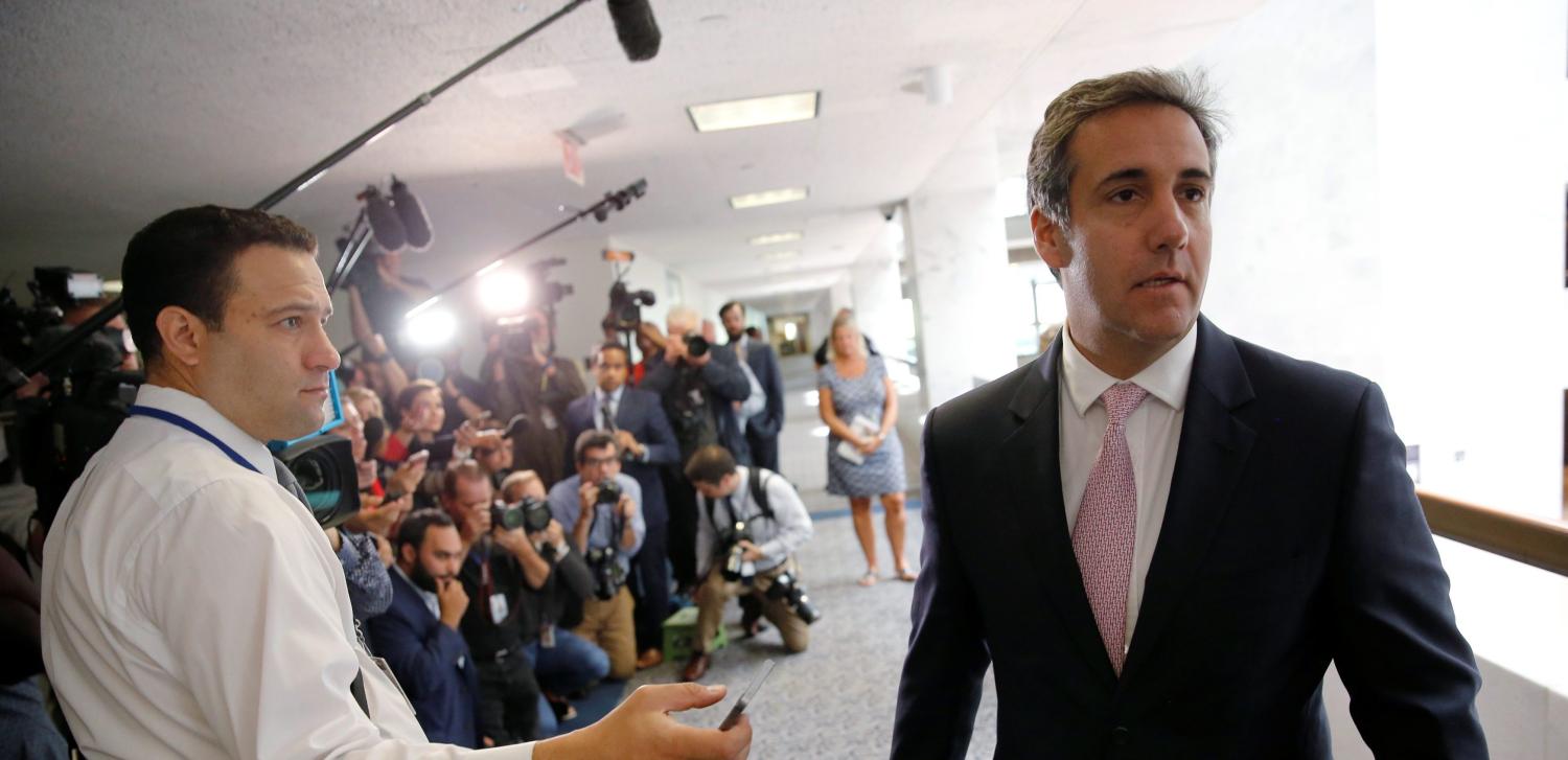 Michael Cohen, personal attorney for U.S. President Donald Trump, talks to reporters as he departs after meeting with Senate Intelligence Committee staff.