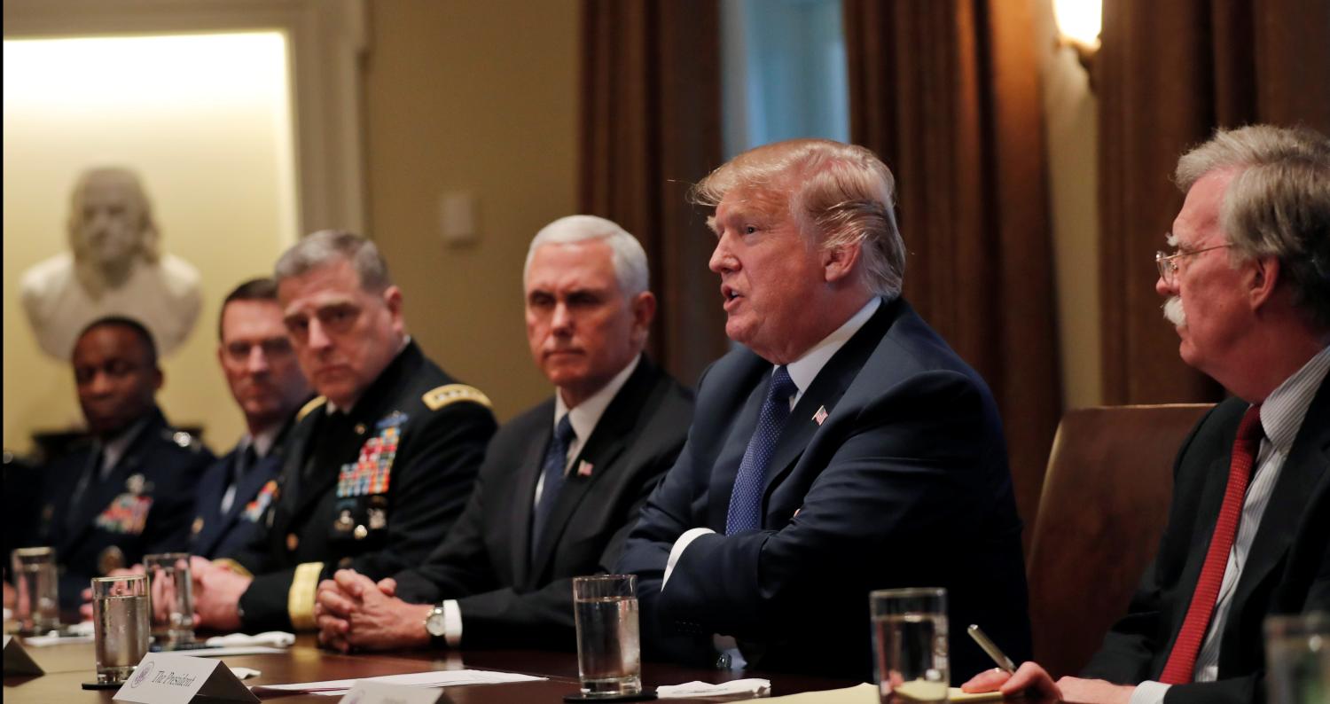 U.S. President Donald Trump receives a briefing from senior military leadership accompanied by Vice President Mike Pence and new National Security Adviser John Bolton.
