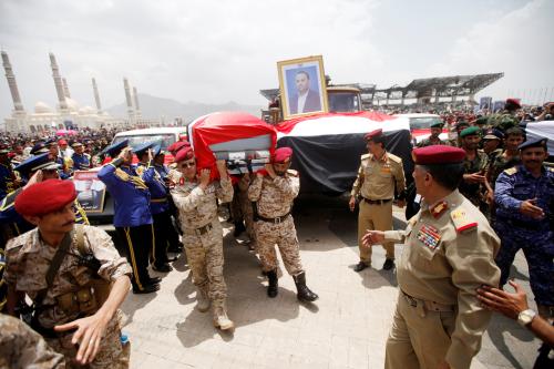 Pro-Houthi army officers carry the coffin of Saleh al-Samad, a senior Houthi official, during a funeral procession held for him and his six body guards, killed by Saudi-led air strikes last week, in Sanaa, Yemen April 28, 2018. REUTERS/Mohamed al-Sayaghi - RC18A83212A0