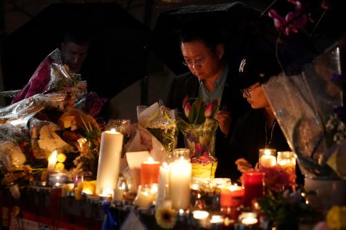 Mourners attend a candlelight vigil at a makeshift memorial on Yonge Street following a van that attacked multiple people in Toronto, Ontario, Canada, April 24, 2018. REUTERS/Carlo Allegri - RC18FFE2D540