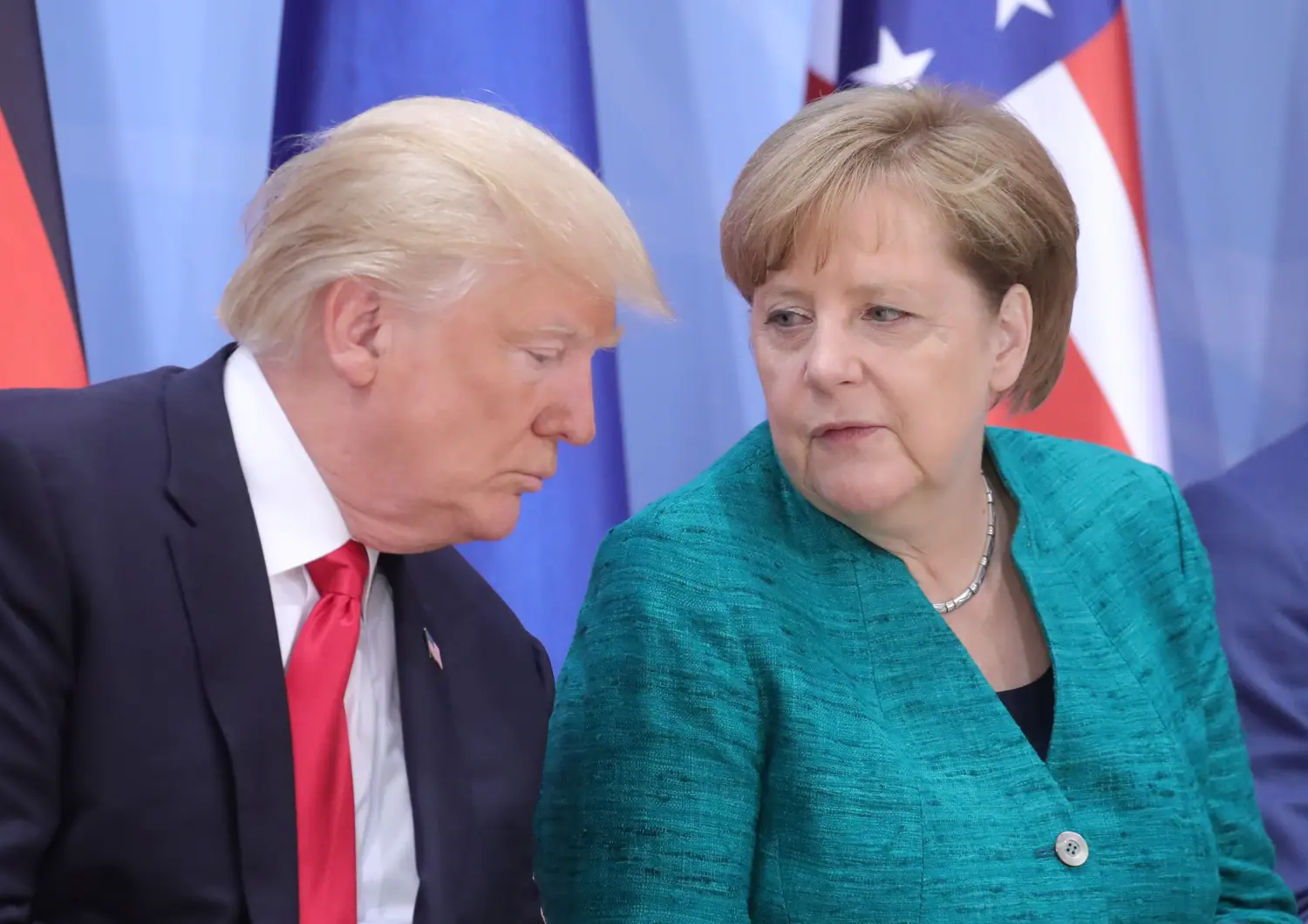 U.S. President Donald Trump and German Chancellor Angela Merkel attend the Womens Entrepreneurship Finance event during the G20 leaders summit in Hamburg, Germany July 8, 2017. REUTERS/Michael Kappeler, Pool - RC1C813C67A0