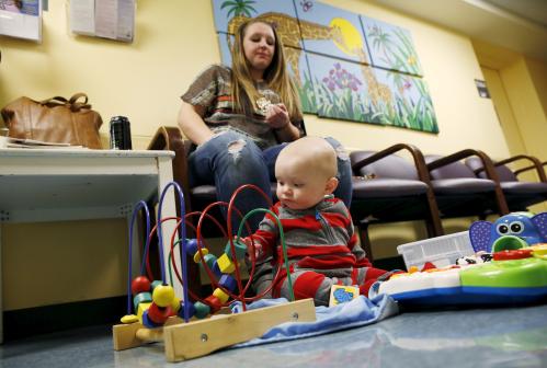 Clorissa Jones sits with her six month-old son Braxton