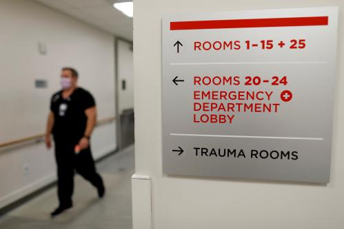 Emergency room nurse Richard Horner wears a mask as he deals with flu patients at Palomar Medical Center in Escondido, California, U.S., January 18, 2018.      REUTERS/Mike Blake - RC1385AE3000