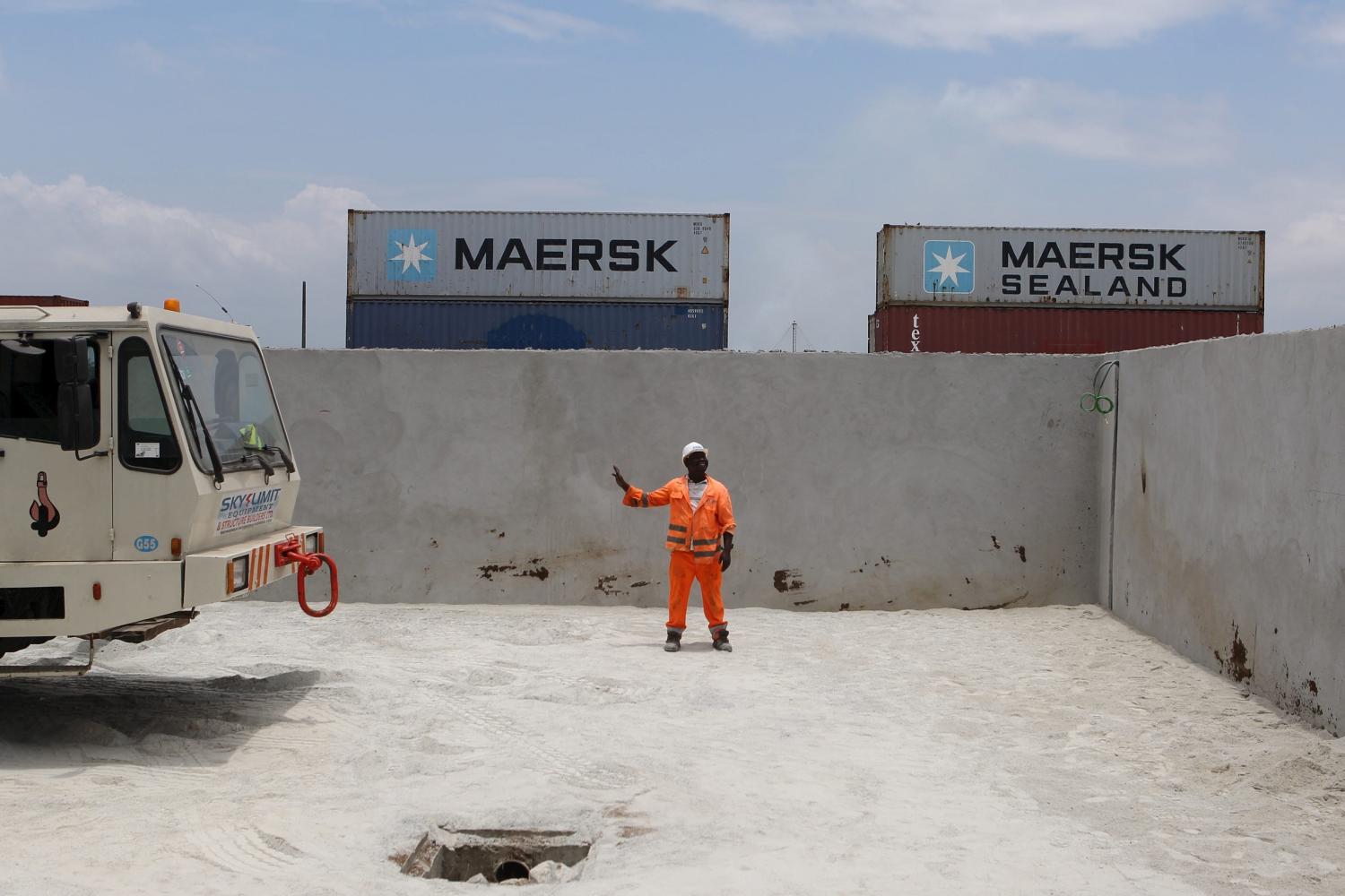 Construction workers direct a crane at the Radisson hotel site in Abidjan, Ivory Coast, September 12, 2015. From Abidjan’s packed airport arrivals hall to the buildings mushrooming across the capital, Ivory Coast is booming, a rare African bright spot as the world’s biggest cocoa producer bounces back from a 2011 civil war. Buyers of luxury apartments include Ivorians living overseas, while promoters from Morocco, Turkey and China are attracted by tax breaks. Elections - the source of national unrest four years ago - are due in a month but there is no let-up in investment given expectations of an easy victory for incumbent Alassane Ouattara. The government predicts 9.6 percent growth this year, making the former French colony the standout performer on a continent hammered by a slump in commodity prices, capital outflows and tumbling currencies. REUTERS/Joe PenneyPICTURE 14 OF 33 FOR WIDER IMAGE STORY "IVORY COAST IS BOOMING". SEARCH "BOOMING PENNEY" FOR ALL IMAGES - GF10000219116