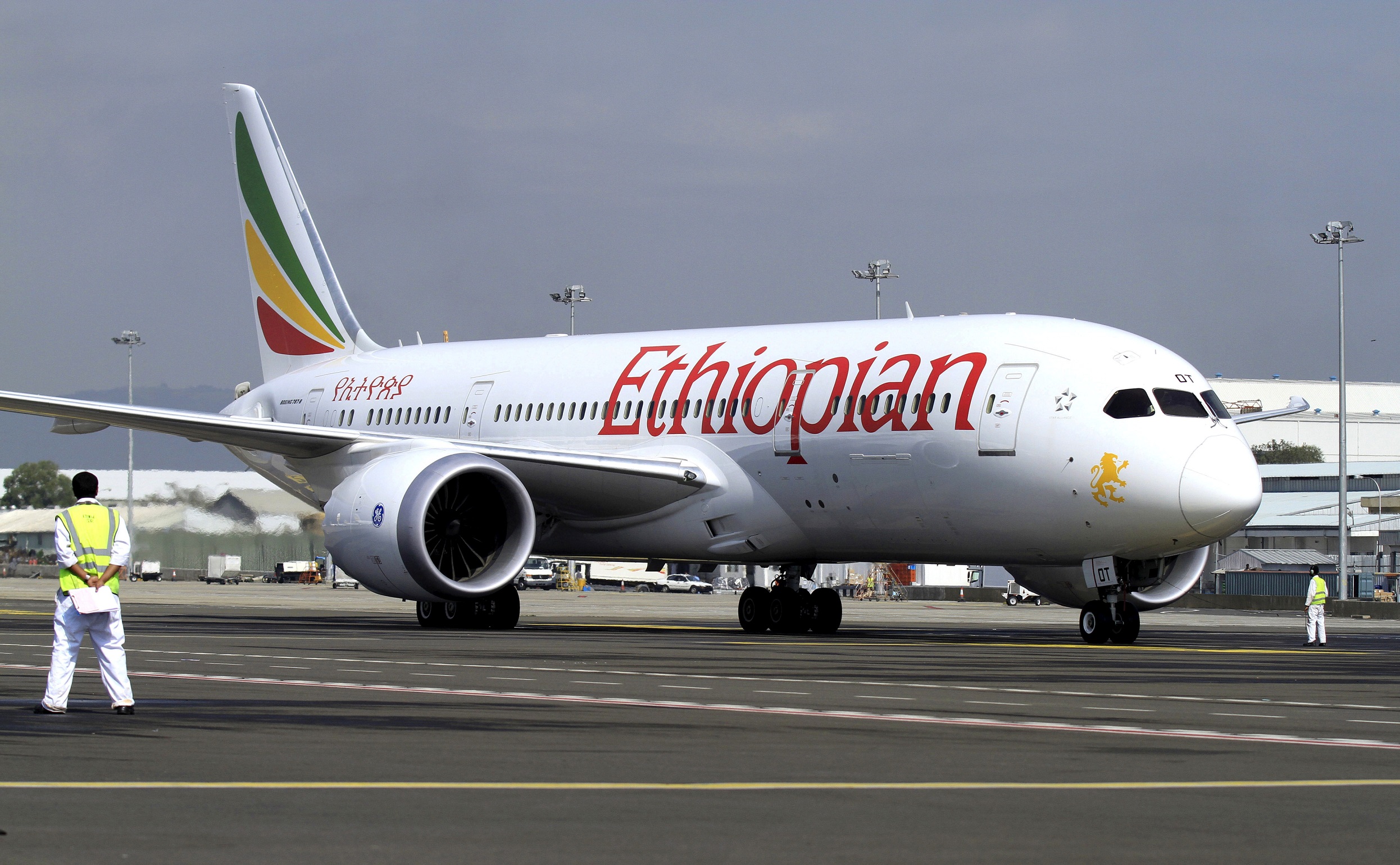FILE PHOTO: A member of the ground crew directs an Ethiopian Airlines plane at the Bole International Airport in Ethiopia's capital Addis Ababa, August 21, 2015. REUTERS/Tiksa Negeri/File Photo - RC159E9D1C00