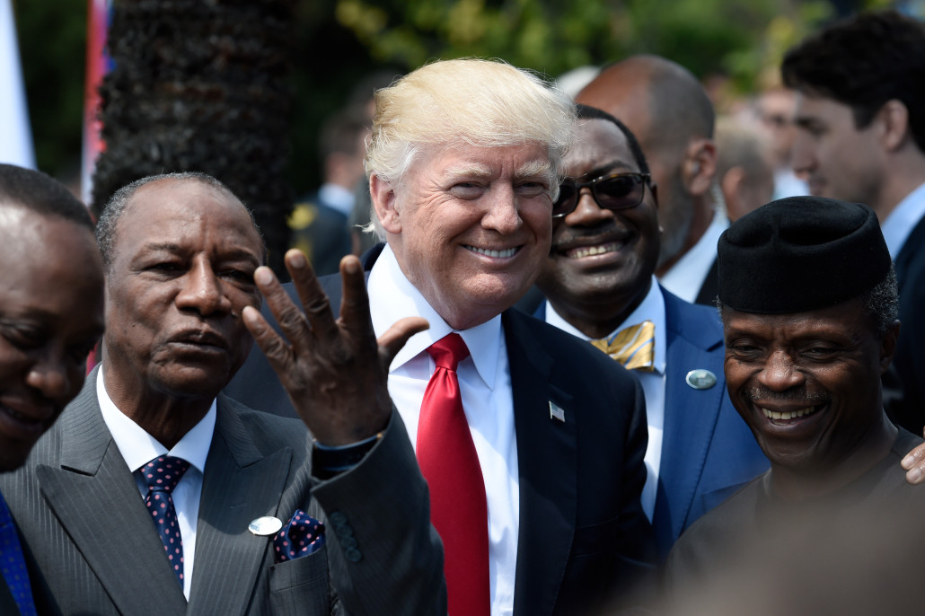 U.S. President Donald Trump shares a laugh with Guinea's President Alpha Conde (L), the Vice President of Nigeria Yemi Osinbajo (R) and other African leaders as they arrive to pose for a family photo with participants of the G7 summit during the Summit of the Heads of State and of Governments of the G7, the group of most industrialized economies, plus the European Union, in Taormina, Sicily, Italy, May 27, 2017. REUTERS/Stephane de Sakutin/Pool - RC1D3FEB60A0