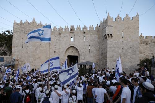 Israelis celebrate as they hold Israeli flags during a parade marking the annual Jerusalem Day, at Damascus Gate in Jerusalem's Old City, May 13, 2018. REUTERS/Ammar Awad - RC1A6A0D5F10