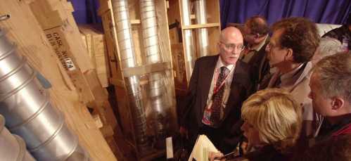 U.S. Department of State Ambassador Donald Mahley (C), an expert on weapons of mass destruction, talks to reporters about Libya's nuclear weapons program during a press briefing at the Y-12 National Security Complex in Oak Ridge, Tennessee, March 15, 2004. On display are a portion of the 55,000-pounds of weapons-making components that were airlifted from Libya by a joint U.S.-British team on January 27, 2004. MANDATORY CREDIT REUTERS/Paul Efird/Knoxville News Sentinel  PE/HK - RP4DRIHEDIAA