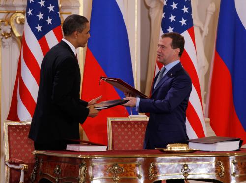U.S. President Barack Obama ( L) and Russian President Dmitry Medvedev (R) exchange documents after signing the new Strategic Arms Reduction Treaty (START II) at Prague Castle in Prague, April 8, 2010.      REUTERS/Jason Reed      (CZECH REPUBLIC - Tags: POLITICS MILITARY) - GM1E6481MCS01
