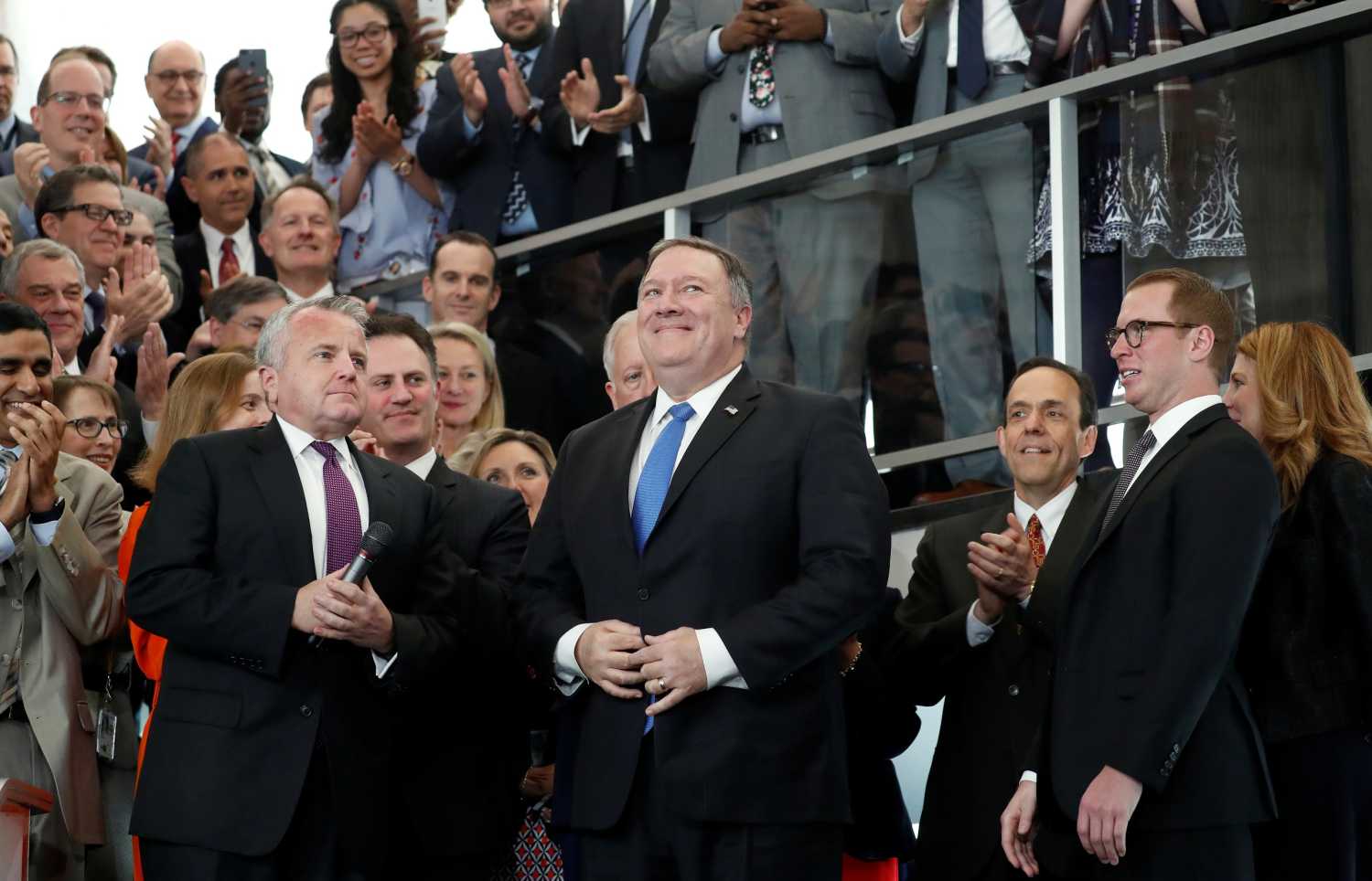New United States Secretary of State Mike Pompeo receives applause as he delivers remarks to employees on his first day at the State Department in Washington, U.S., May 1, 2018. REUTERS/Kevin Lamarque - RC18CB0C5310