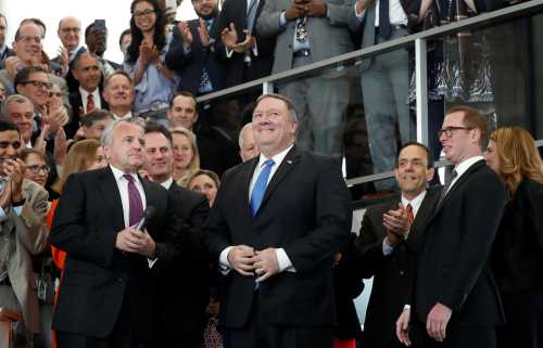 New United States Secretary of State Mike Pompeo receives applause as he delivers remarks to employees on his first day at the State Department in Washington, U.S., May 1, 2018. REUTERS/Kevin Lamarque - RC18CB0C5310