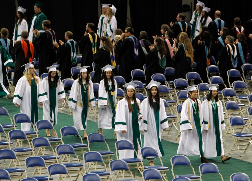 Reynolds High School students take part in a processional march at graduation ceremony.