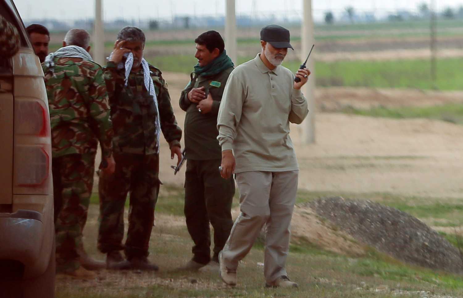 Iranian Revolutionary Guard Commander Qassem Soleimani uses a walkie-talkie at the frontline during offensive operations against Islamic State militants in the town of Tal Ksaiba in Salahuddin province March 8, 2015. Picture taken March 8, 2015. REUTERS/Stringer
