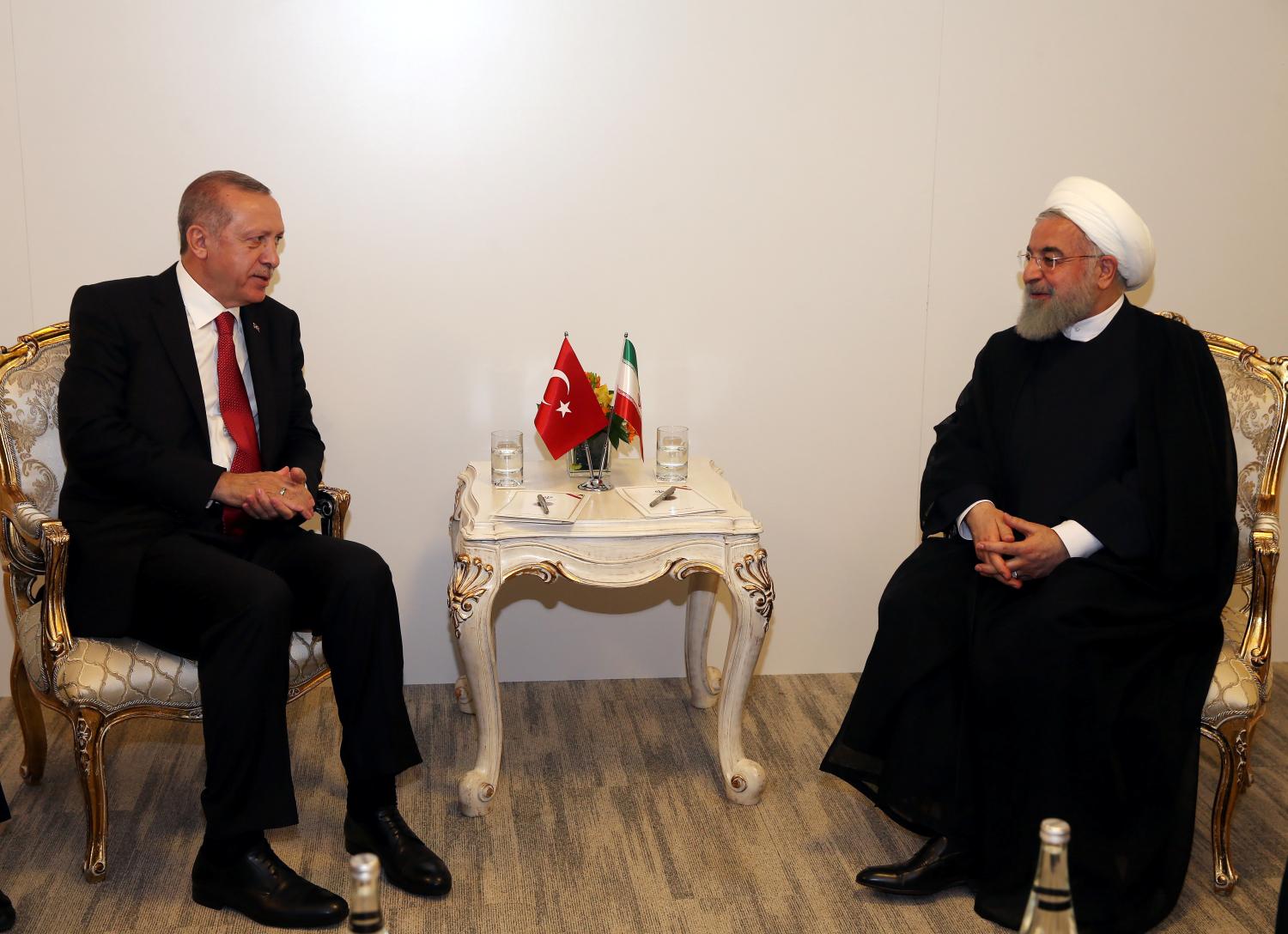 Turkish President Tayyip Erdogan meets with Iranian counterpart Hassan Rouhani during an extraordinary meeting of the Organisation of Islamic Cooperation (OIC) in Istanbul, Turkey May 18, 2018. Cem Oksuz/Pool via Reuters -