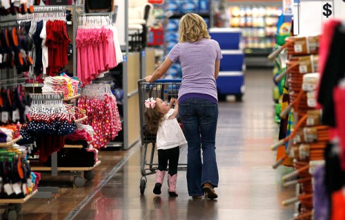 A woman shops with her daughter at a Walmart Supercenter in Rogers, Arkansas June 6, 2013. The annual shareholders meeting for Walmart takes place on June 7. REUTERS/Rick Wilking (UNITED STATES - Tags: BUSINESS) - GM1E96703QJ01