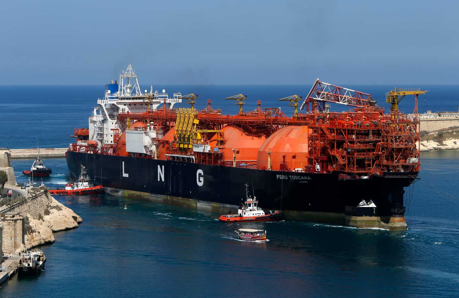 The Offshore LNG regasification terminal, the FSRU Toscana, is towed into Valletta's Grand Harbour July 1, 2013. The FSRU Toscana, a converted ship and the first offshore-moored floating regasification plant in the world, is on its way from Dubai to Livorno, Italy, where it will be permanently moored and used as a gas terminal and export point, according to local media. REUTERS/Darrin Zammit Lupi (MALTA - Tags: MARITIME BUSINESS ENERGY) MALTA OUT. NO COMMERCIAL OR EDITORIAL SALES IN MALTA - GM1E97204JP01