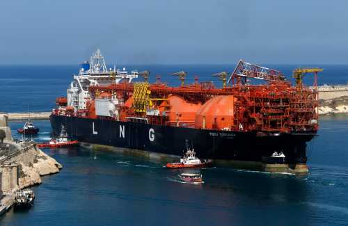 The Offshore LNG regasification terminal, the FSRU Toscana, is towed into Valletta's Grand Harbour July 1, 2013. The FSRU Toscana, a converted ship and the first offshore-moored floating regasification plant in the world, is on its way from Dubai to Livorno, Italy, where it will be permanently moored and used as a gas terminal and export point, according to local media. REUTERS/Darrin Zammit Lupi (MALTA - Tags: MARITIME BUSINESS ENERGY) MALTA OUT. NO COMMERCIAL OR EDITORIAL SALES IN MALTA - GM1E97204JP01