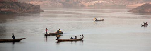 Wooden canoes cross the Ubangi River from the Democratic Republic of Congo to the capital Bangui, Central African Republic, February 15, 2016. Picture taken on February 15, 2016. REUTERS/Siegfried Modola  - GF10000318371