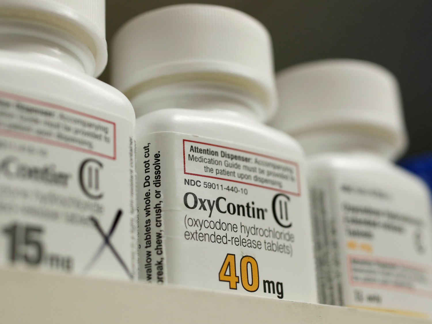 Bottles of prescription painkiller OxyContin made by Purdue Pharma LP sit on a shelf at a local pharmacy in Provo, Utah, U.S., April 25, 2017.   REUTERS/George Frey - RC137E5423F0