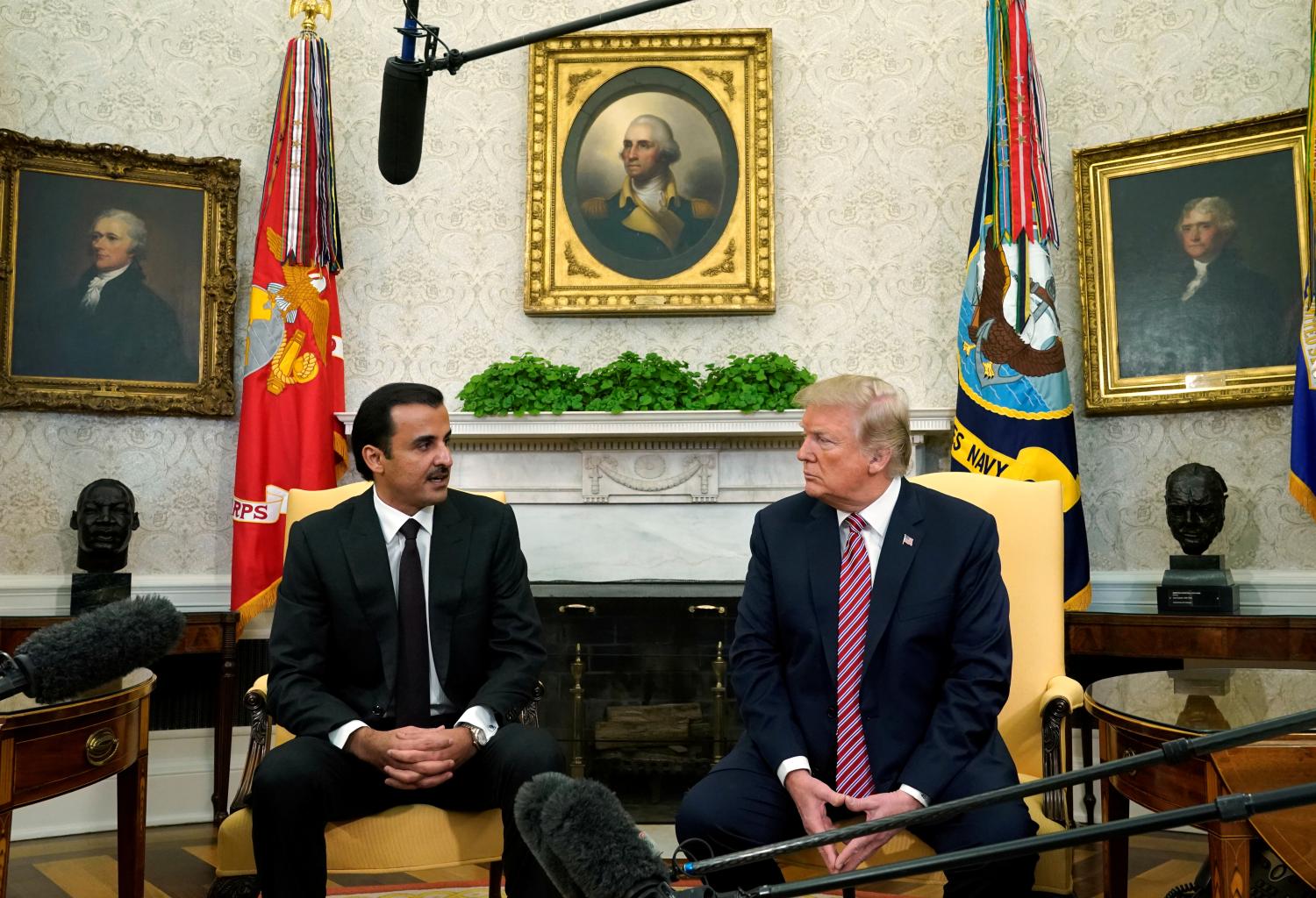 U.S. President Donald Trump meets Qatar's Emir Sheikh Tamim bin Hamad al-Thani in the Oval Office at the White House in Washington. U.S., April 10, 2018. REUTERS/Kevin