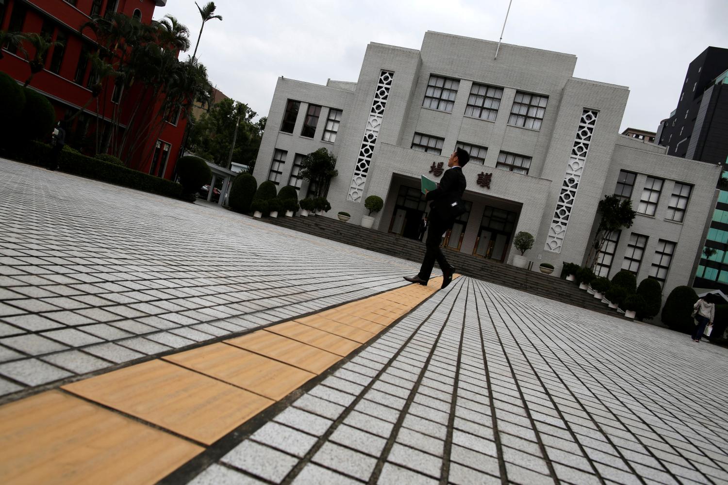 A man walks in front of the Legislative Yuan Taipei, Taiwan May 17, 2016.