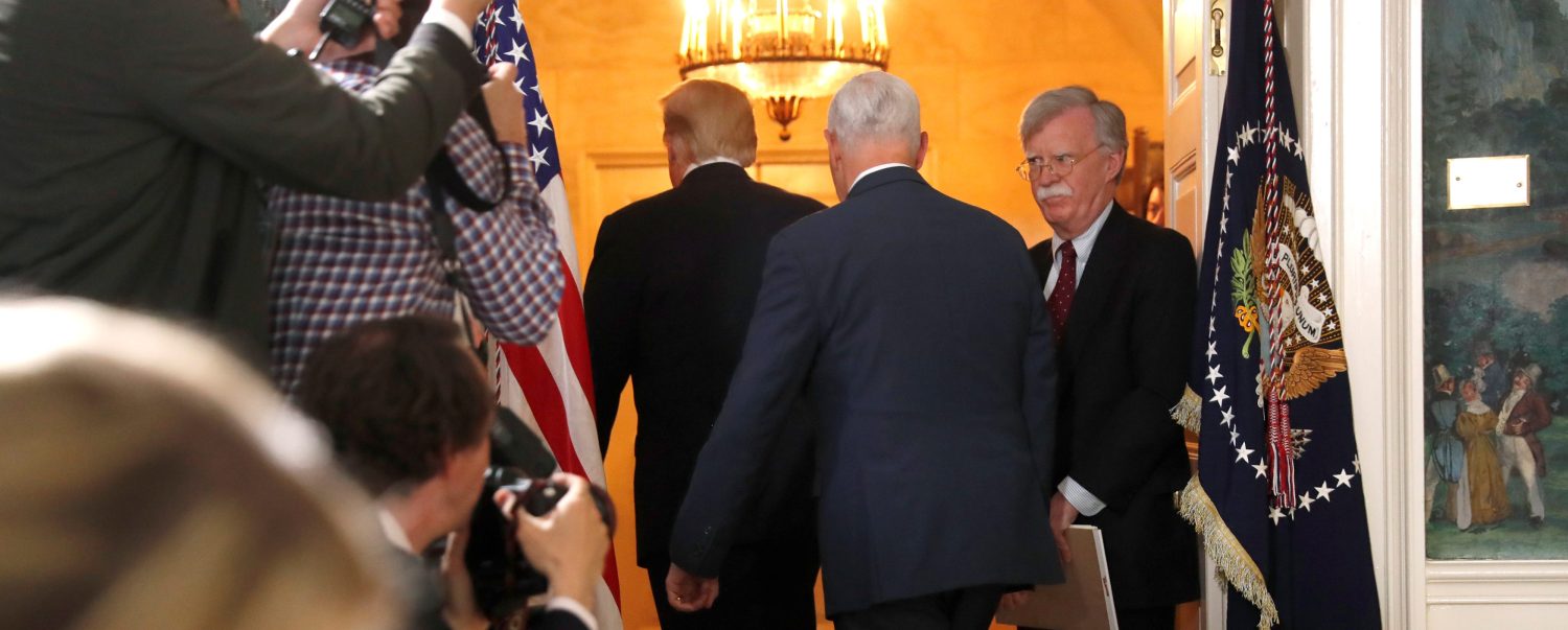 White House National Security Advisor John Bolton (R) departs with U.S. President Donald Trump and Vice President Mike Pence after Trump announced his intention to withdraw from the JCPOA Iran nuclear agreement during a statement in the Diplomatic Room at the White House in Washington, U.S. May 8, 2018.  REUTERS/Jonathan Ernst - RC14BD742E20