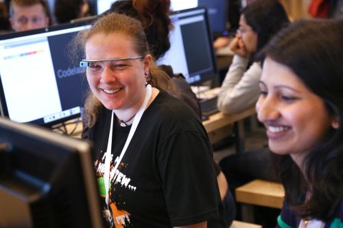 Rachel Wilson (L), of Rockville, Maryland, speaks with Yash Parbhu of Philadelphia, Pennsylvania while learning about the code for some of Google's new APIs at the Google I/O developers conference in San Francisco June 26, 2014. Women attendees constituted 20% of the conference's attendance this year, up from 8% last year. REUTERS/Elijah Nouvelage   (UNITED STATES - Tags: BUSINESS SCIENCE TECHNOLOGY) - GM1EA6R0IP701