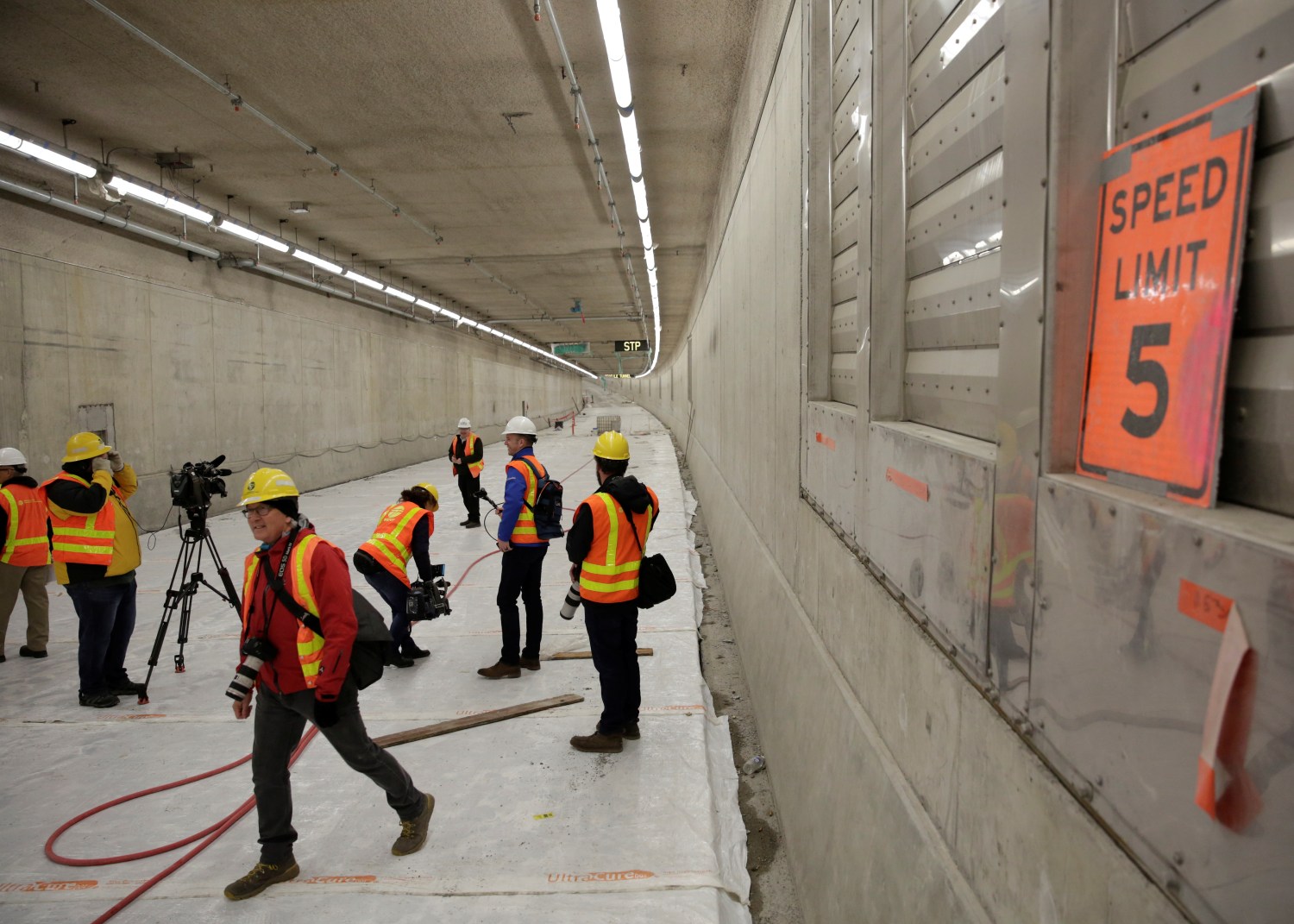 Media are pictured on the lower level northbound lanes, during a tour of the double deck State Route 99 highway tunnel, under construction in Seattle, Washington, U.S., March 27, 2018. REUTERS/Jason Redmond - RC183C60D230